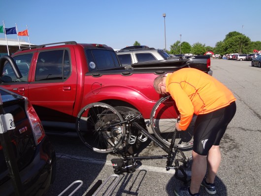 Putting the front wheel on my bike before the ride.  This is notable only if you want to see what my truck looks like, or you really wanted to see a 52 year old in bike shorts.