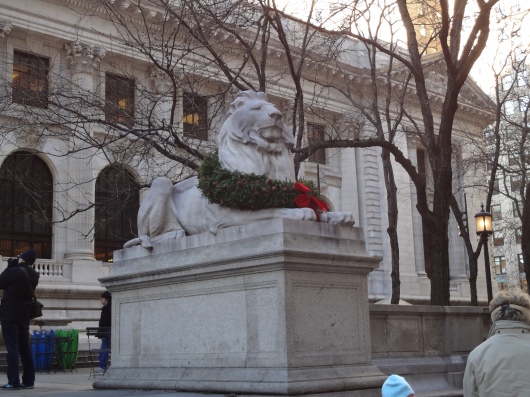 One of the famous lion statues in front of the library, dressed in a wreath.