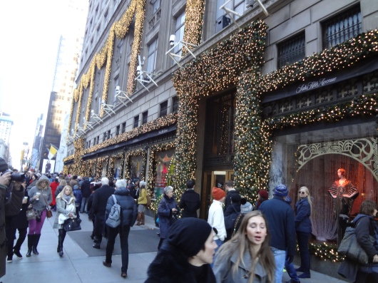The outside of Saks Fifth Avenue.  In the background (look for the yellow & white flag) you can just make out the front of St. Patrick's cathedral, which is in the middle of extensive renovations.